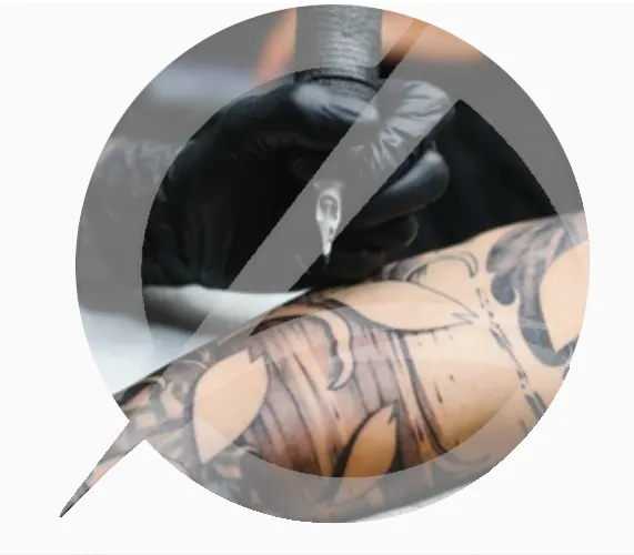 Tattoo artist applying ink to a person's arm featuring intricate leaf designs, highlighting the personal expression and investment in body art relevant to personal loans for tattoos in Australia.